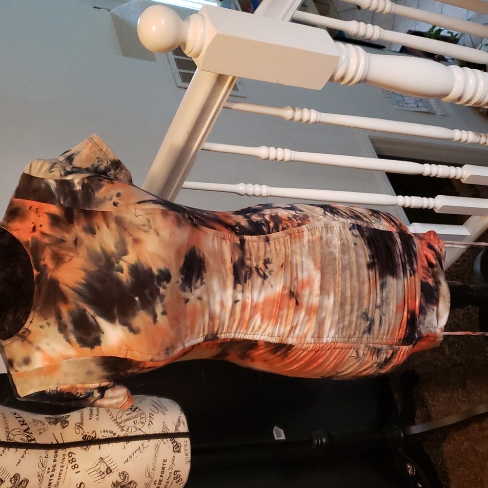 Dress tie dye with rousing down the front.